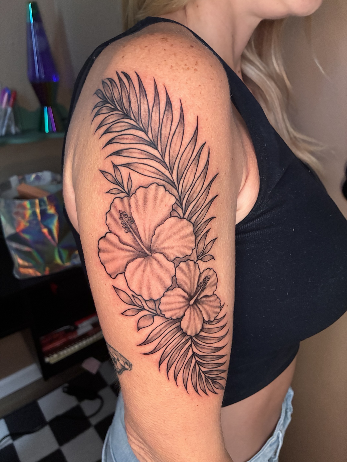 Fine-line tropical floral tattoo by Jen