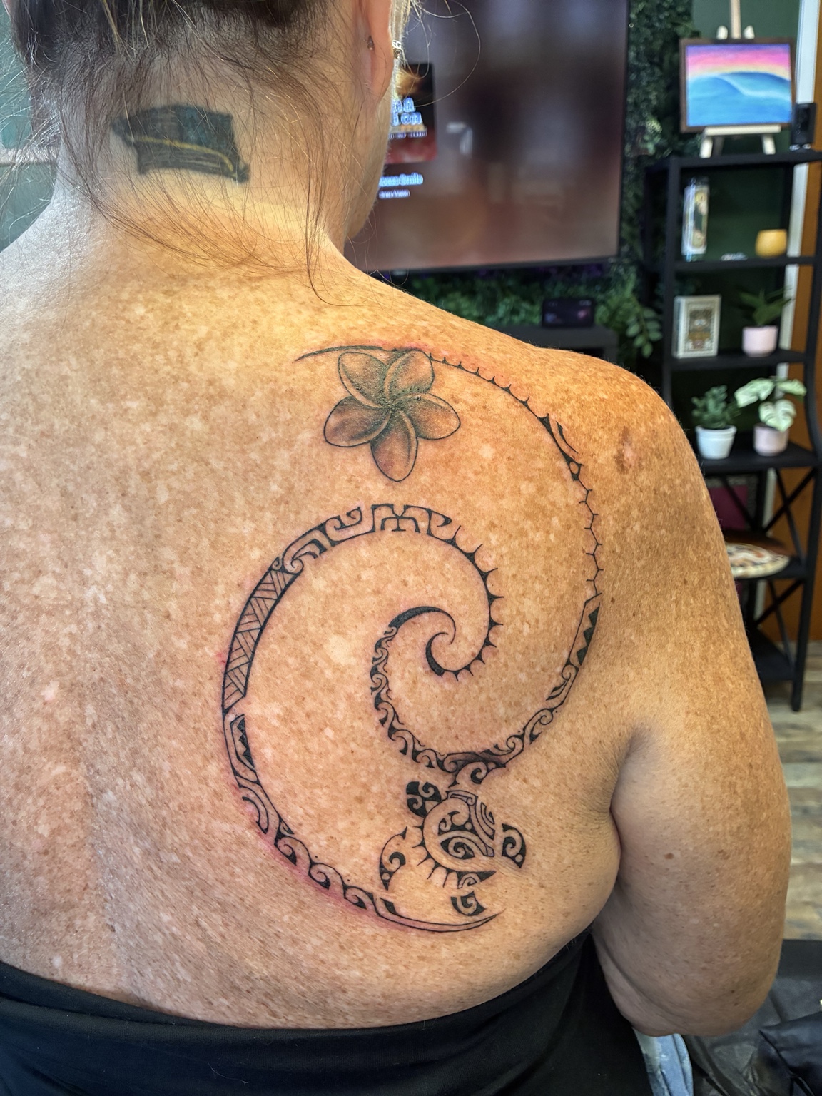 Ocean-inspired Polynesian back tattoo by Jen
